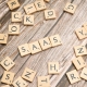 scrabble-letters-spelling-saas-on-a-wooden-tabl