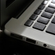 Free Detailed view of a silver laptop showing keyboard and multiple ports. Stock Photo