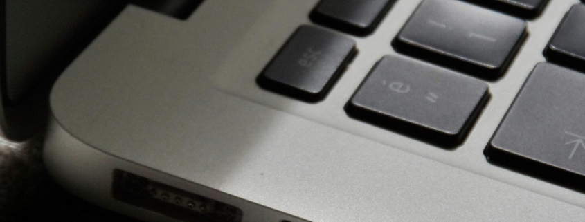 Free Detailed view of a silver laptop showing keyboard and multiple ports. Stock Photo